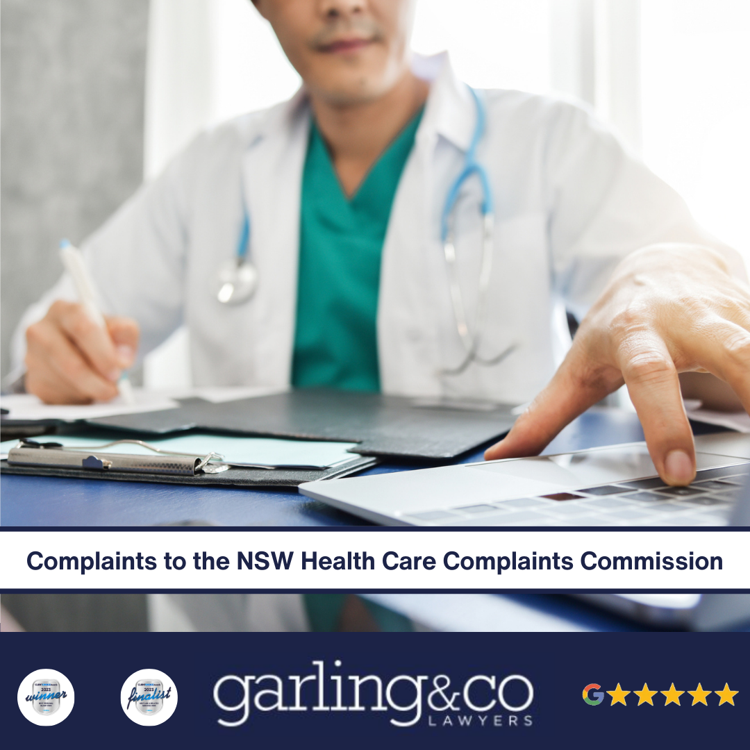 A doctor with one hand on a computer and the other holding a pen writing down something on a paper with a clipboard with the caption “Complaints to the NSW Health Care Complaints Commission”