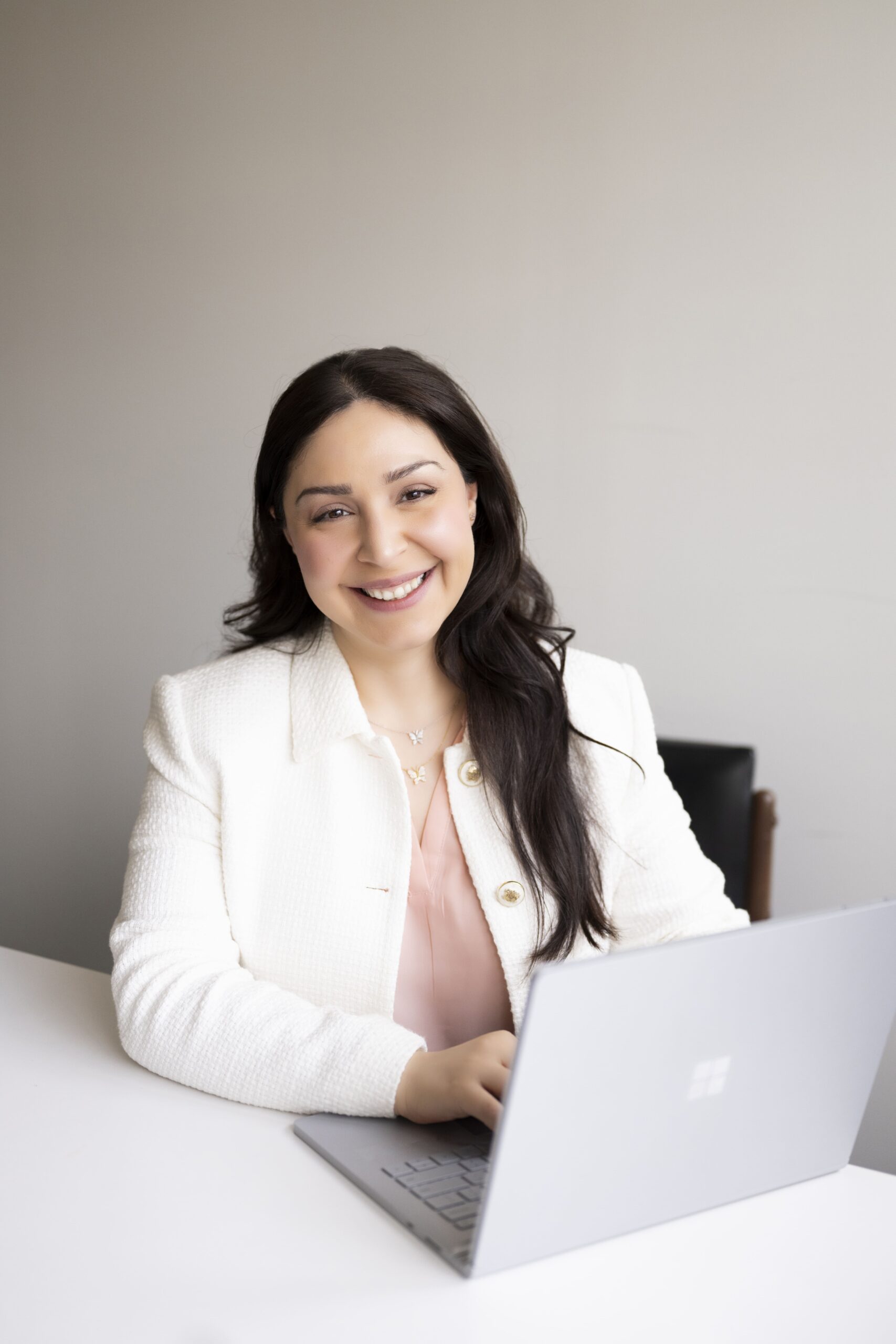 Professional woman typing on laptop